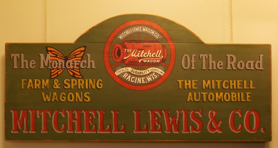 This sign hangs in the museum and incorporates one of the early Mitchell wagon slogans.