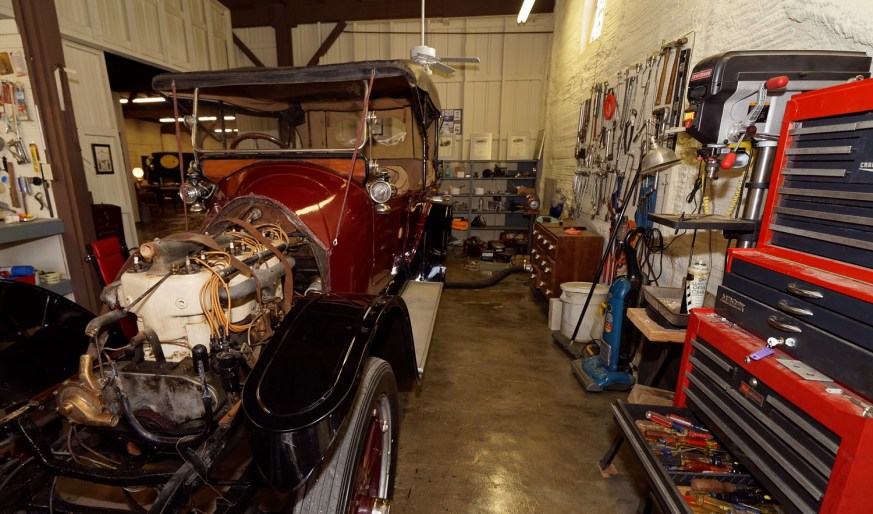 Lewis's shop area with his 1914 Mitchell Touring Car.